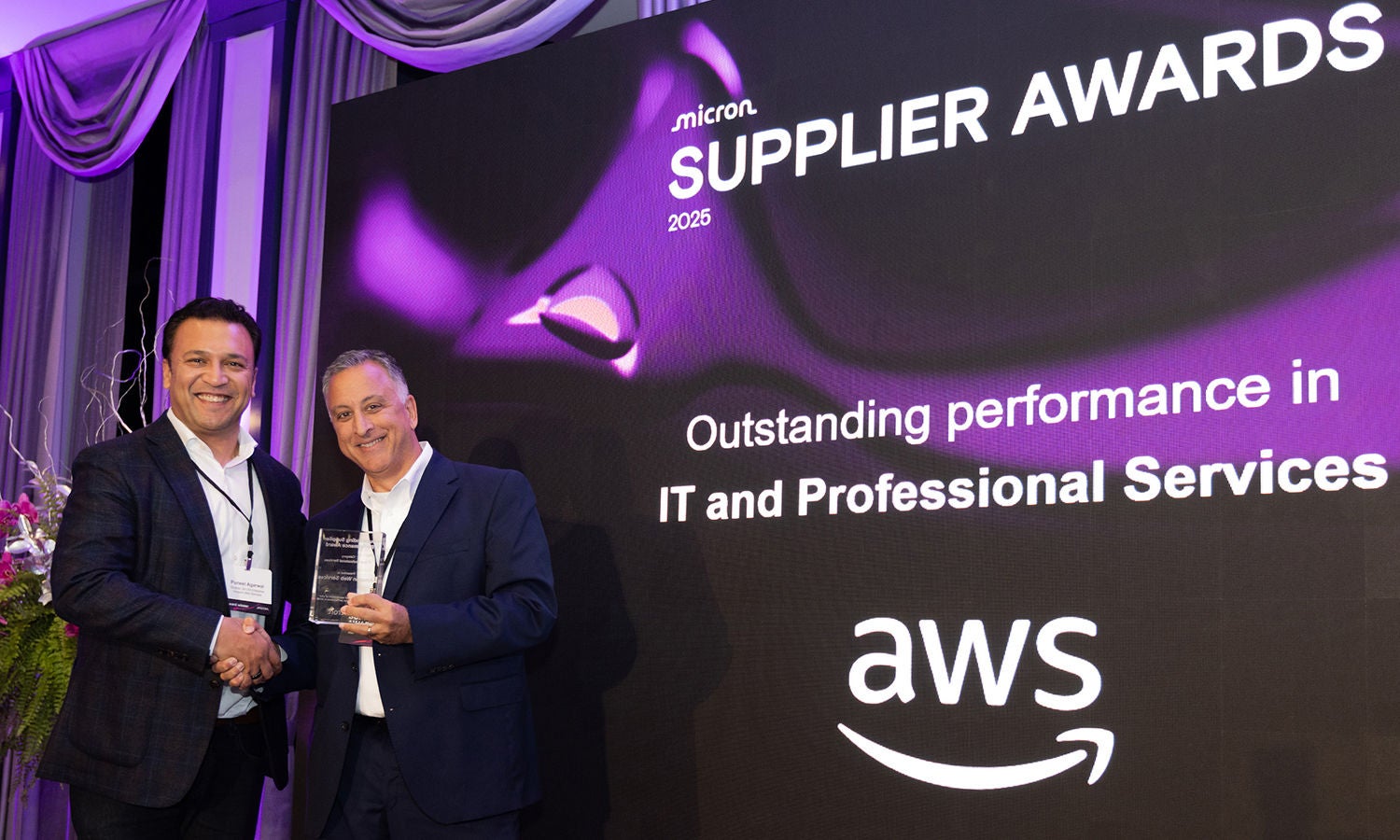 Anand Bahl presenting the Outstanding Performance Award to Puneet Agarwal